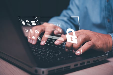 Hands typing on keyboard and security message showing