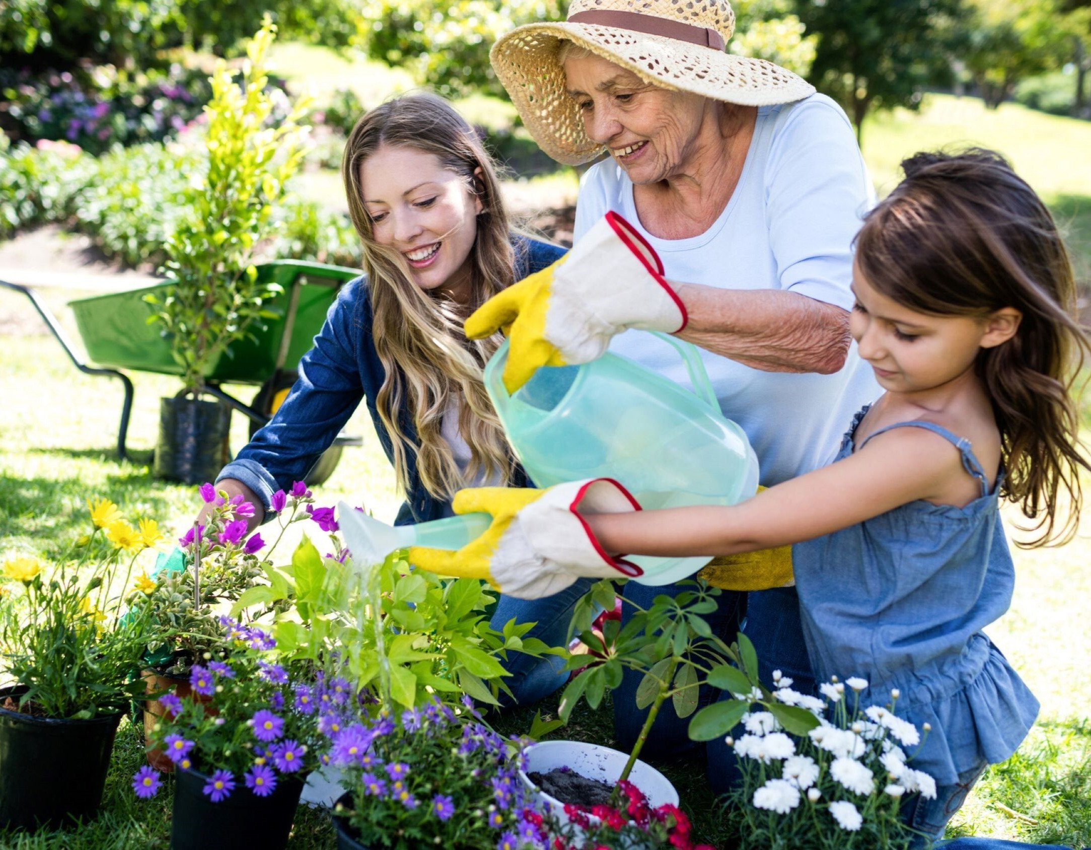 grandma & granddaughters watering flowers - copy-3-1